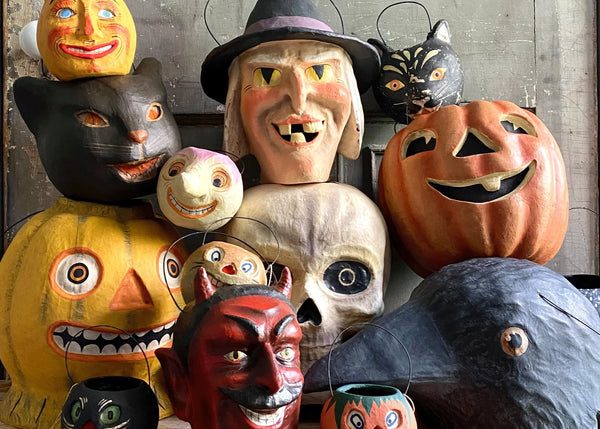 Spooky, vintage halloween inspired candy buckets stacked on top of each other