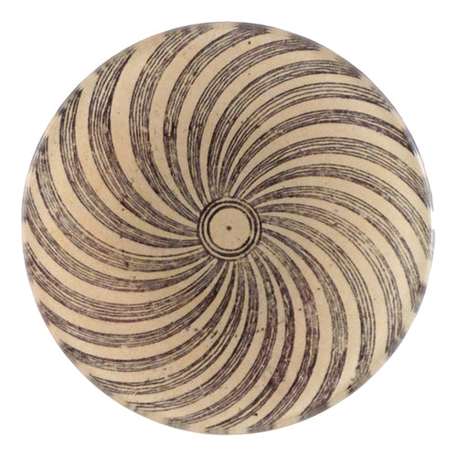 A four inch round handmade decoupage plate titled Pinwheel