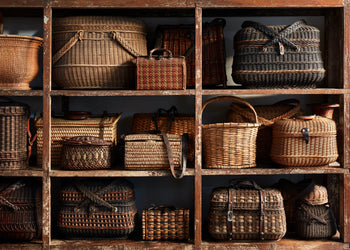Antique baskets of various sizes on a shelf