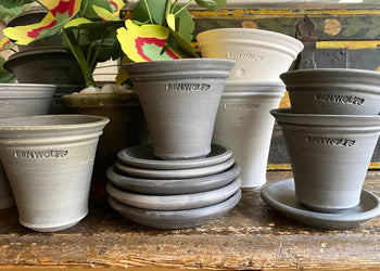 Clay plant pots stacked on a table
