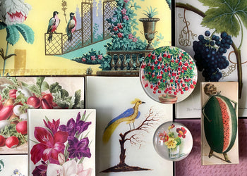 glass decoupaged plates with antique images of birds, flowers, and fruits