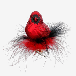 A red cardinal bird ornament with black feather accents and a small silver-toned bird figurine underneath, shown against a plain light gray background.