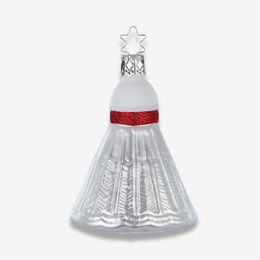 A Christmas ornament shaped like a badminton birdie a silver metal star hanger on a light gray background.
