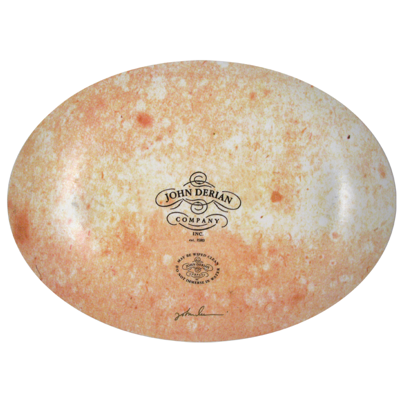 The back of a ten inch by fourteen inch horizontal glass plate with the John Derian Company logo and sticker signed by John Derian.  