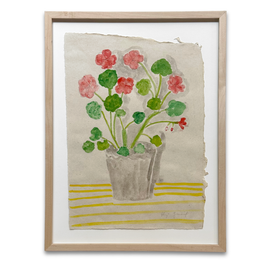 A framed watercolor painting of geraniums in a pot, featuring pink flowers and green leaves on a textured beige background with yellow stripes, enclosed in a light wood frame.