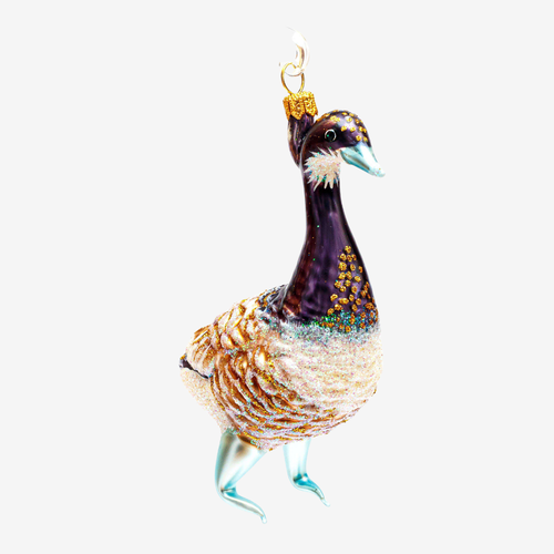 A decorative bird ornament with a dark purple neck, patterned brown and cream body, and light blue legs and beak, shown against a plain light gray background.