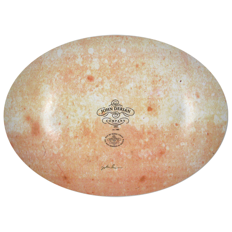 The back of a thirteen inch by eighteen inch oval plate with the John Derian logo, sticker and signed by John Derian. 