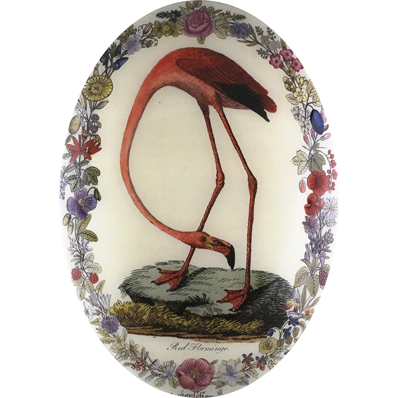 A thirteen inch by eighteen inch vertical oval convex glass plate with a pink flamingo looking down, surrounded by a floral boarder.