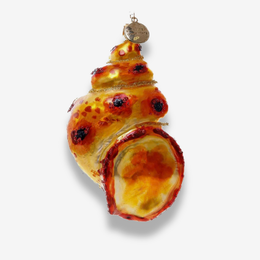 A spiral shell-shaped Christmas ornament designed to look like a peach or orange with glossy yellow and red sections, dark spots, and a small gold hanging loop at the top, shown on a light gray background.