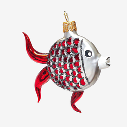 A decorative fish-shaped Christmas ornament with a silver body, red scales outlined in black glitter, and translucent red fins, shown on a plain light gray background.