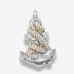 A nautical-themed Christmas ornament shaped like an anchor with spiral seashells wrapped around it, shown on a light gray background.