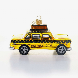 A glass hand-painted ornament shaped like a New York City retro taxi won a white background