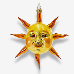 A decorative hanging ornament shaped like a smiling sun face, with a glossy yellow center and orange-brown rays, shown against a light gray background.