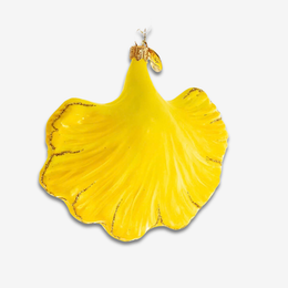 A bright yellow, petal- or leaf-shaped decorative object with a glossy finish and subtle gold veining, shown against a plain light gray background.