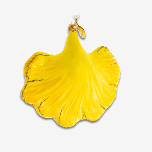 A bright yellow, petal- or leaf-shaped decorative object with a glossy finish and subtle gold veining, shown against a plain light gray background.