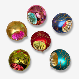 Set of six decorative Christmas ornaments shaped like overlapping spheres, each with metallic gold glitter swirls and a colorful fan-like pattern inside. The ornaments are in different colors: gold, pink, blue, red, yellow-green, and teal, arranged on a light gray background.