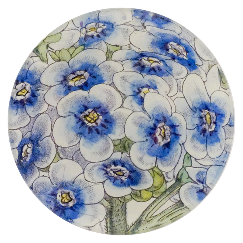 A four inch round plate with blue and white floral pattern on a white background