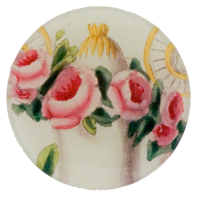 A four inch round plate with pink roses and a carriage design on a white background
