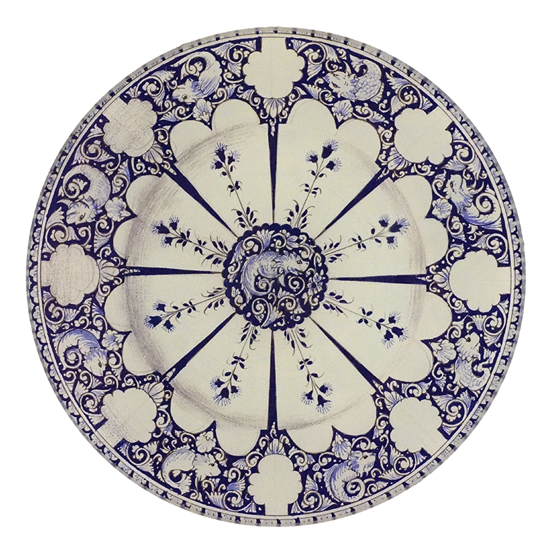 A five inch round glass plate featuring a blue and white motif with a reptile in the center