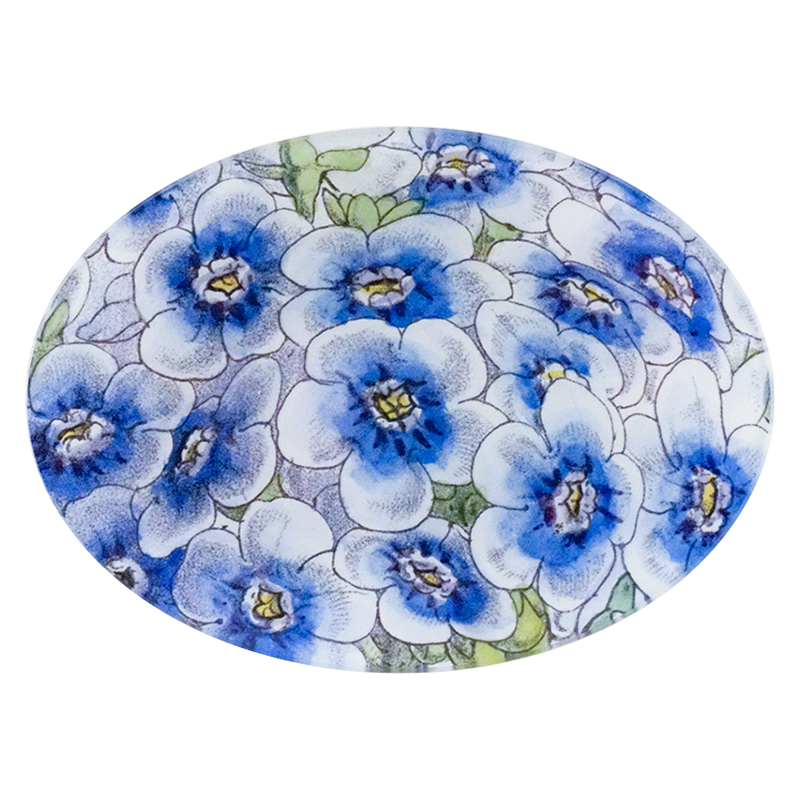 A five inch by seven inch glass plate with blue and white floral pattern. 