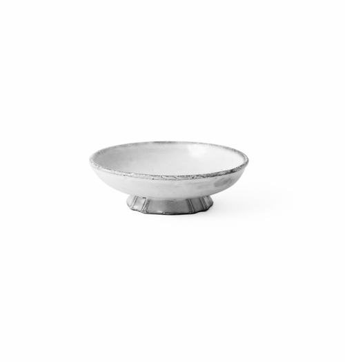 A small round pedestal dish with a textured, distressed white and gray finish, set against a solid white background.