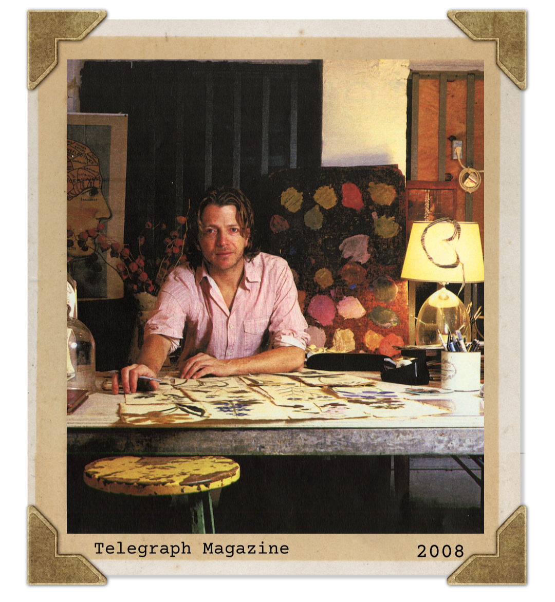 Man sitting at a desk with artwork in a decorated room, labeled 'Telegraph Magazine 2008'.