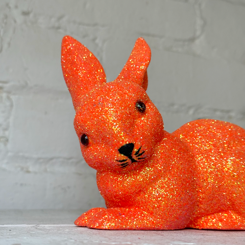 Ino Schaller Lying Glitter Bunny in Orange with Tail