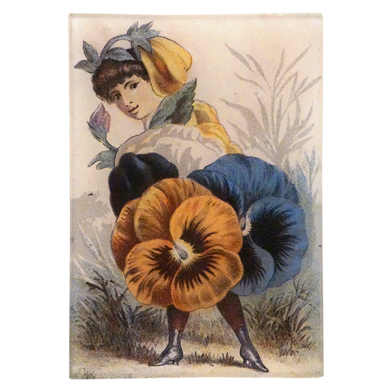 Vintage-style illustration of a woman with large flowers as clothing on a three and a half inch by six and a half inch glass tray. 