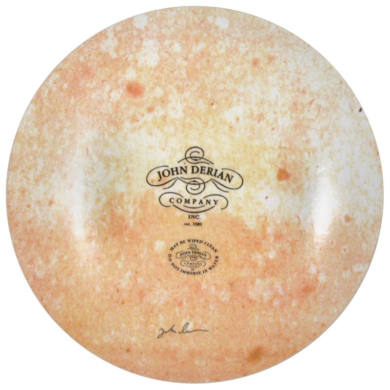 The back of an 11-inch round plate  featuring the signature John Derian Company sticker and signed by John Derian. 
