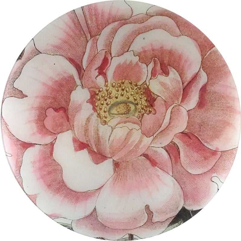 A 16-inch round glass plate featuring a pink and white floral pattern.