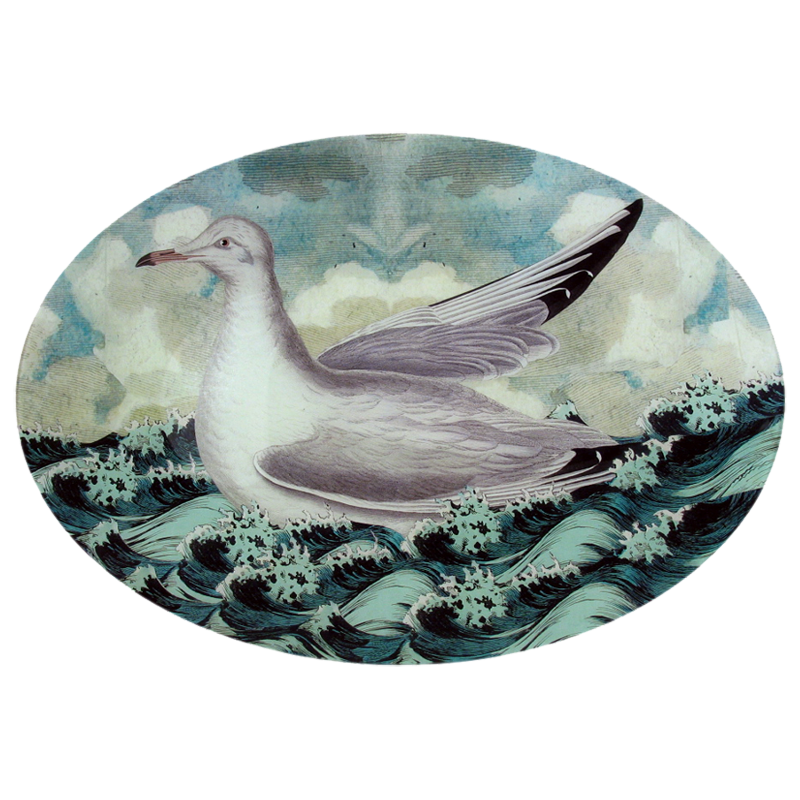 A thirteen inch by eighteen inch horizontal oval glass plate featuring a seagull collage over waves and clouds. 