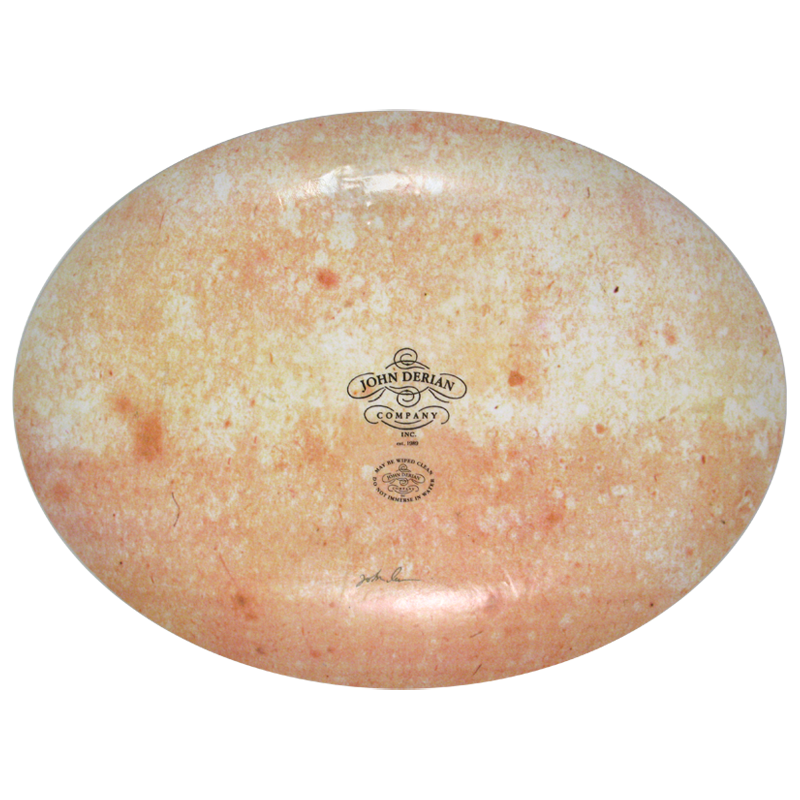 The back of a fourteen inch by nineteen inch oval plate with the John Derian logo, sticker and signed by John Derian. 