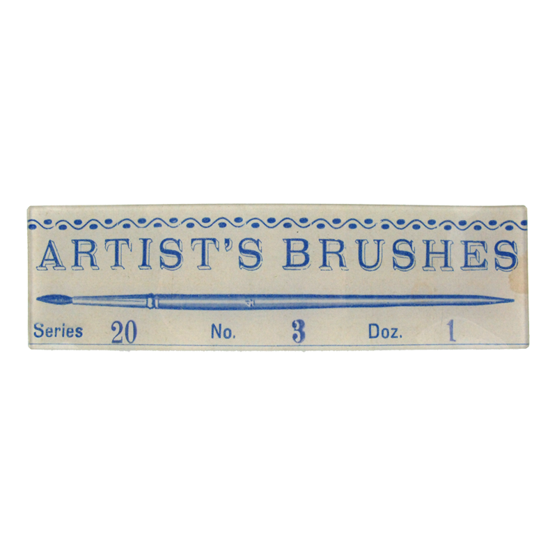 A vintage-style paintbrush cover with 'Artist's Brushes' text in blue font on a three and a half inch by twelve inch glass tray. 