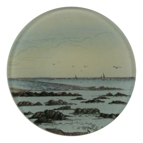 A four inch round handmade decoupage plate titled The Shore