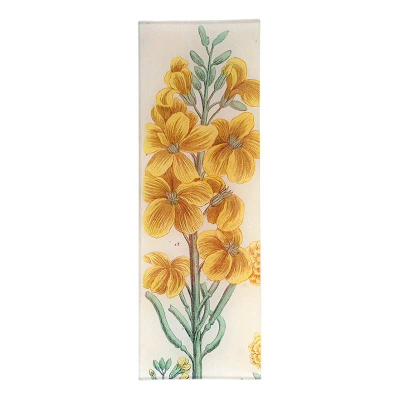 An illustration of a yellow floral design on a four and a half inch by nine inch glass tray. 