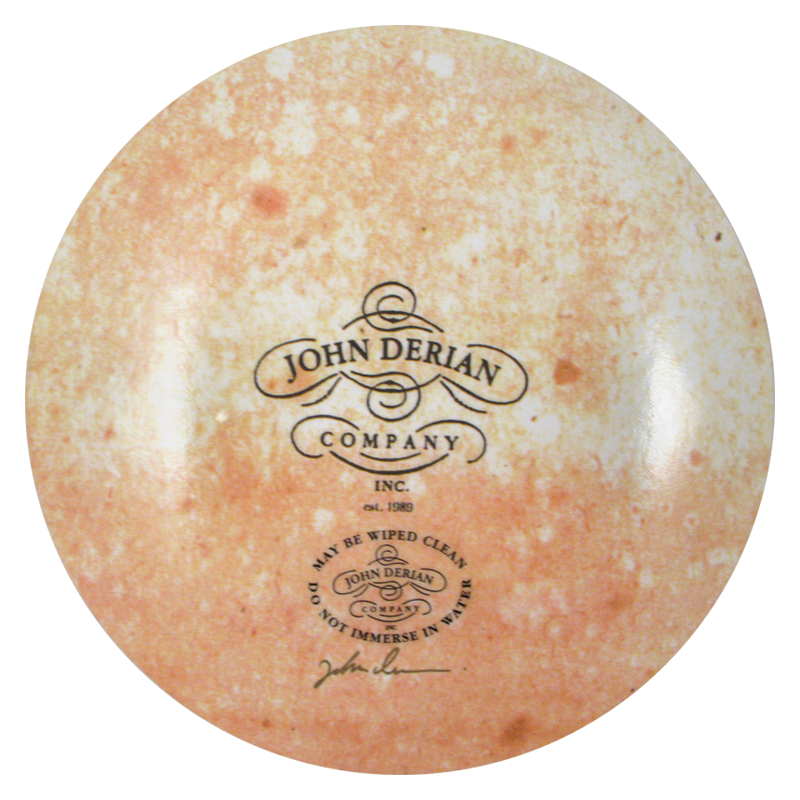 The back of a seven inch round plate  featuring the signature John Derian Company sticker and signed by John Derian. 