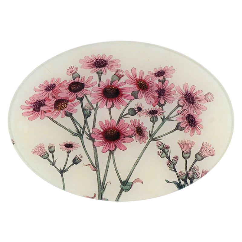 A seven inch by ten inch horizontal glass plate with a floral pattern, featuring pink daisy flowers.
