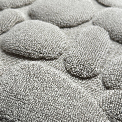 Textured grey bathmat detail