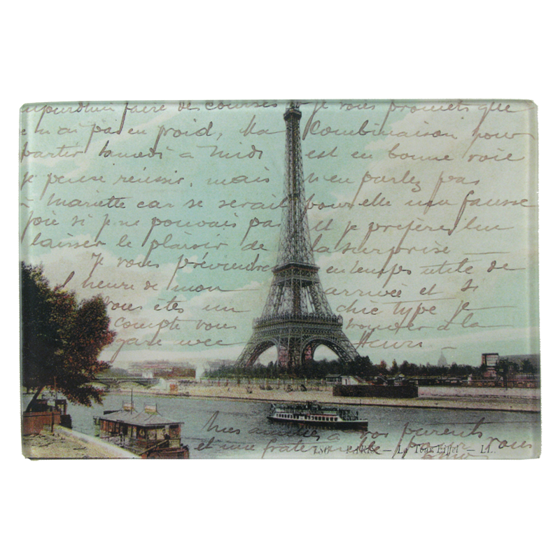 An illustration of Paris imagery including the Eiffel Tower, the Seine River, and a boat on a four and a half inch by six inch glass tray. 