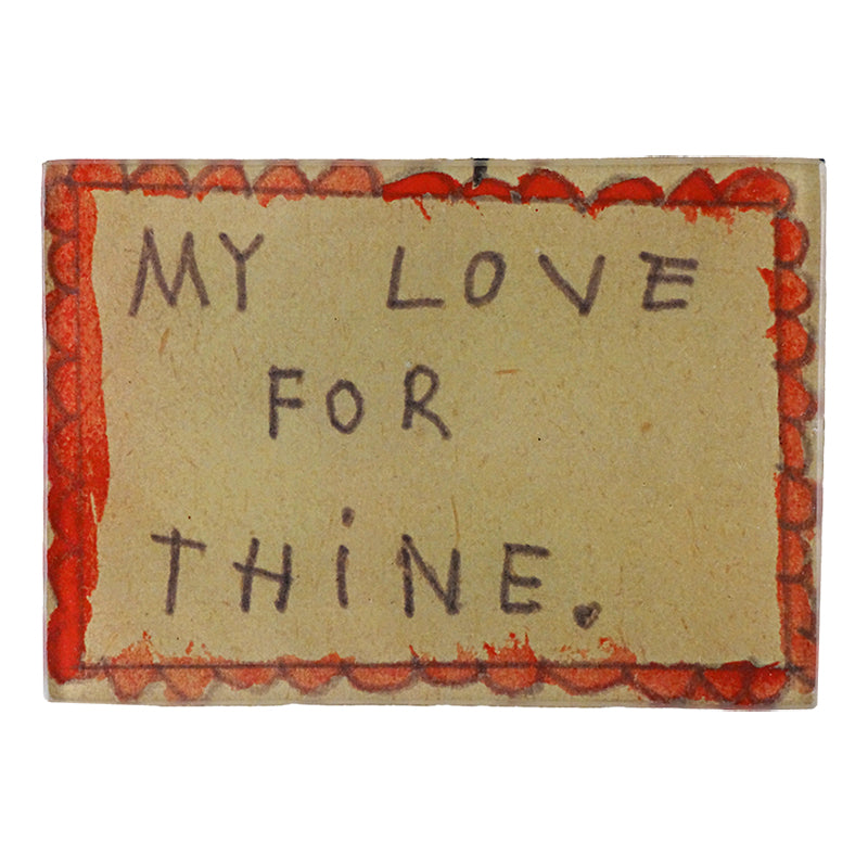 A glass tray with the words 'MY LOVE FOR THINE' written on it, predominantly beige in color with a red border and decorative elements. This is three and a half inches by five inches. 